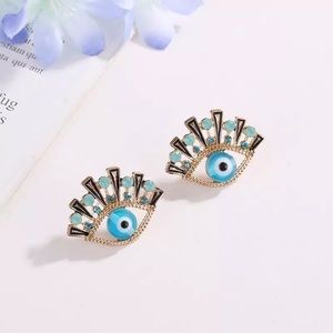 Only ships with $15 orders. Blue Eye Stud Earrings